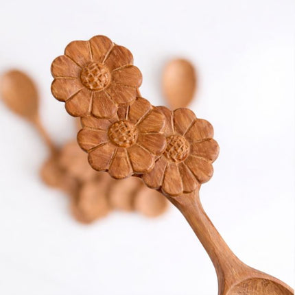 Handcrafted wooden spoon with three flower handle, beautiful design perfect for home decor and everyday use.