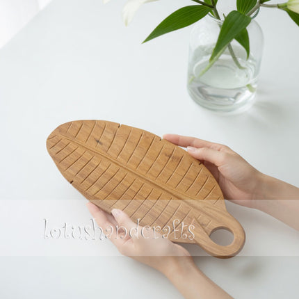 Handcarved wood leaf shape serving tray that is easy to clean and practical for daily use.