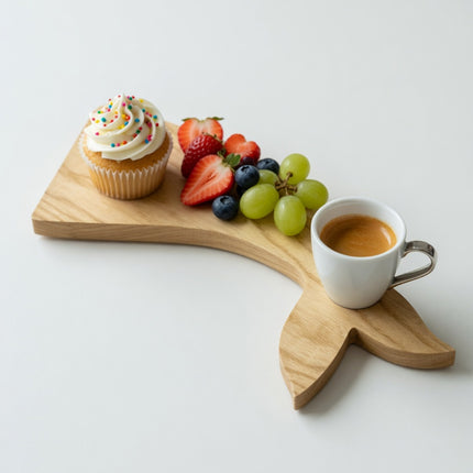 Handcrafted wooden whale tail shape tray made from natural wood with elegant design.