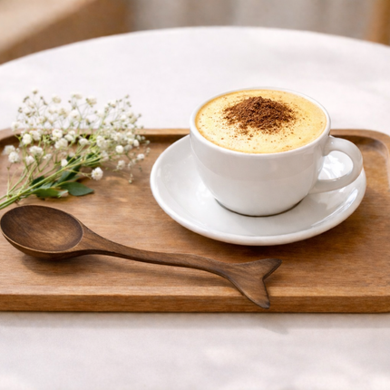 A cute wooden whale tail spice spoon made from natural wood adds charm to kitchens.